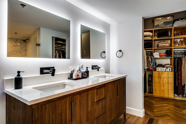 bathroom featuring vanity and parquet flooring