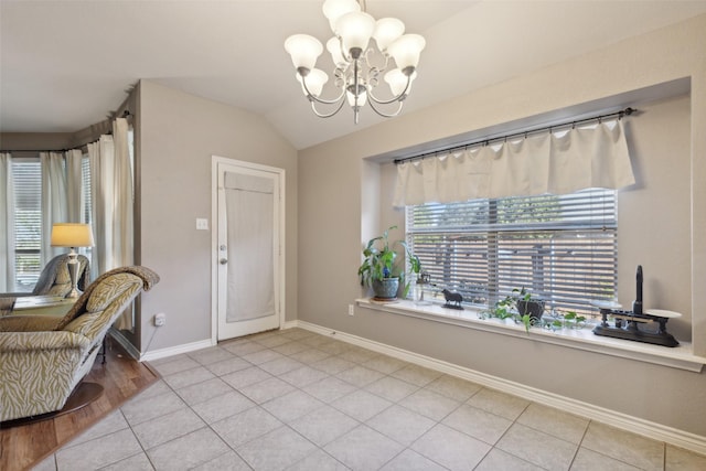 1600 Stanford Ln, Celina, TX 75009 - entryway with a chandelier, baseboards, lofted ceiling, and light tile patterned floors