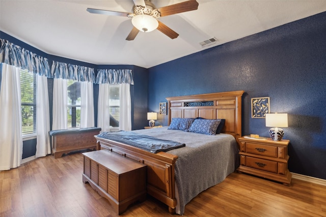 1600 Stanford Ln, Celina, TX 75009 - bedroom featuring wood finished floors, a textured wall, baseboards, and a ceiling fan
