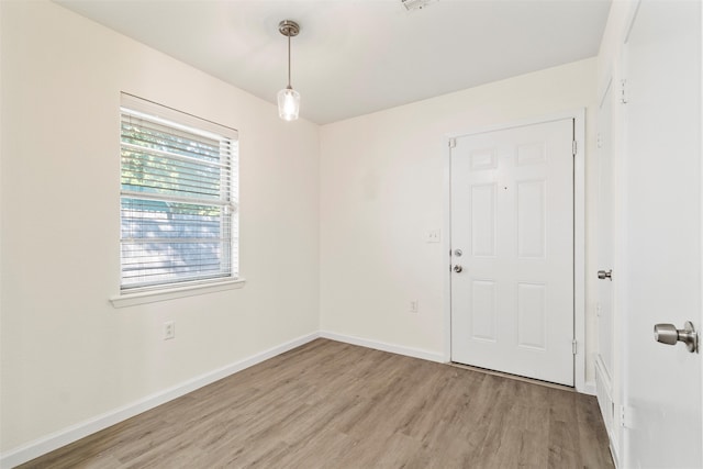 spare room with light wood-type flooring