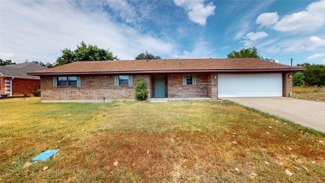 single story home featuring a garage and a front yard