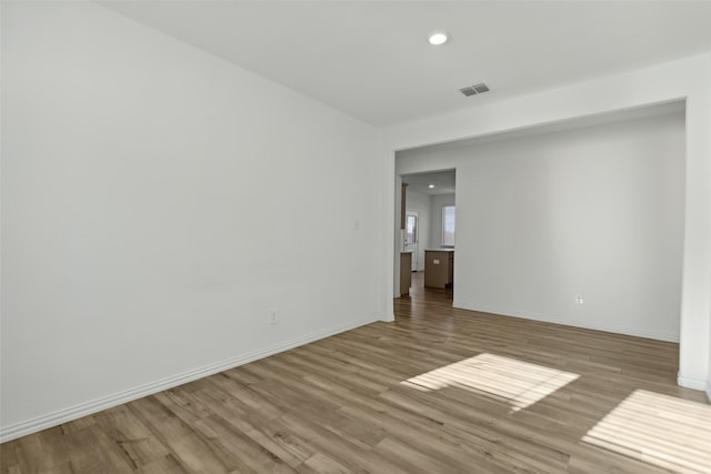 spare room with light hardwood / wood-style floors