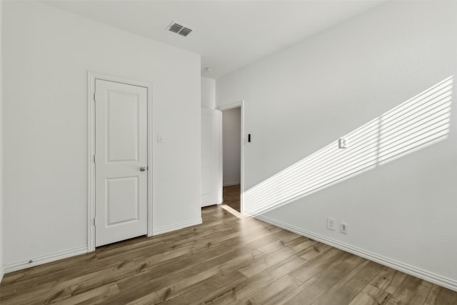 empty room featuring hardwood / wood-style flooring