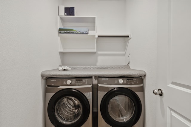 laundry room with washing machine and clothes dryer