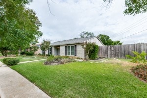 view of home's exterior featuring a lawn