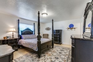 bedroom featuring a textured ceiling