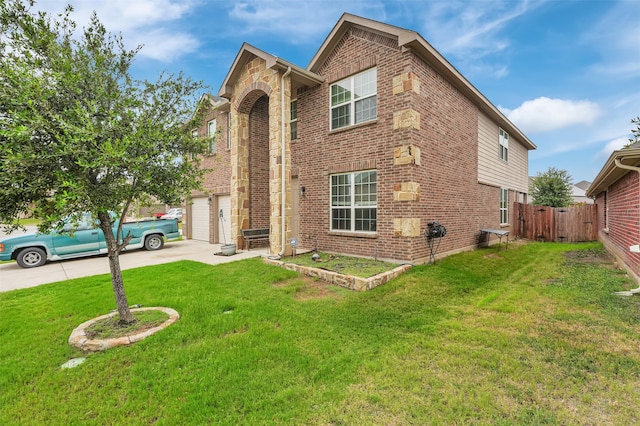 view of front of home featuring a garage and a front yard