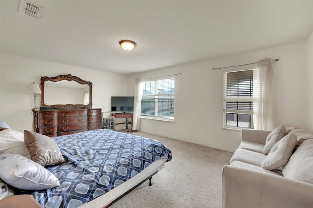 bedroom featuring light colored carpet