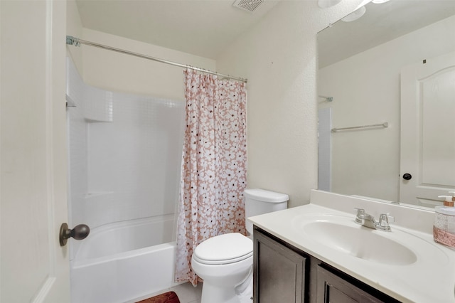 full bathroom featuring shower / bath combination with curtain, toilet, and vanity