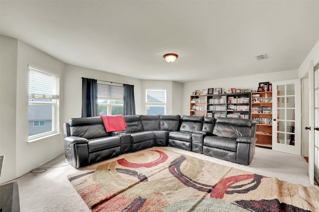 carpeted living room featuring french doors