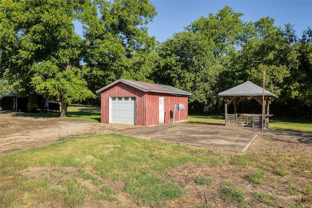 garage featuring a yard