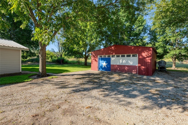 garage featuring a yard