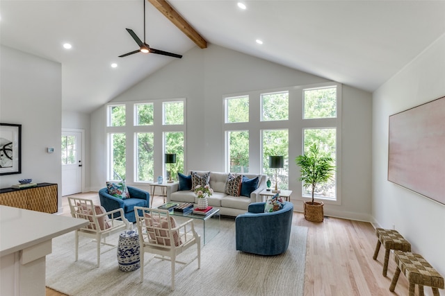 living room with high vaulted ceiling, a wealth of natural light, light hardwood / wood-style flooring, and ceiling fan