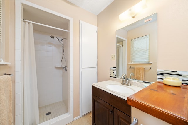 bathroom with a textured ceiling, a shower with shower curtain, vanity, tasteful backsplash, and tile patterned floors