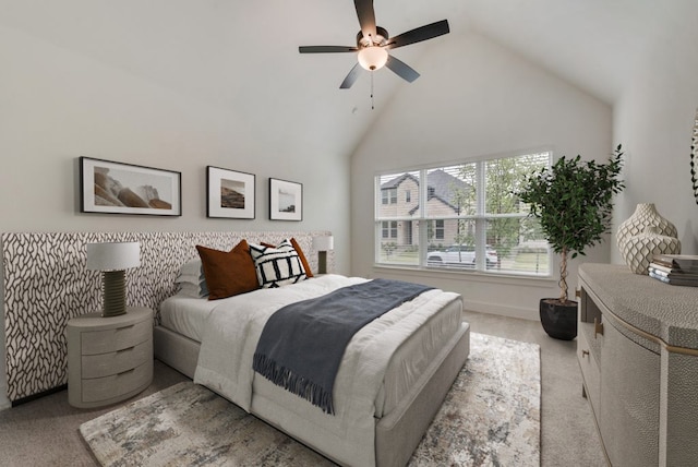 bedroom featuring high vaulted ceiling, light carpet, and ceiling fan