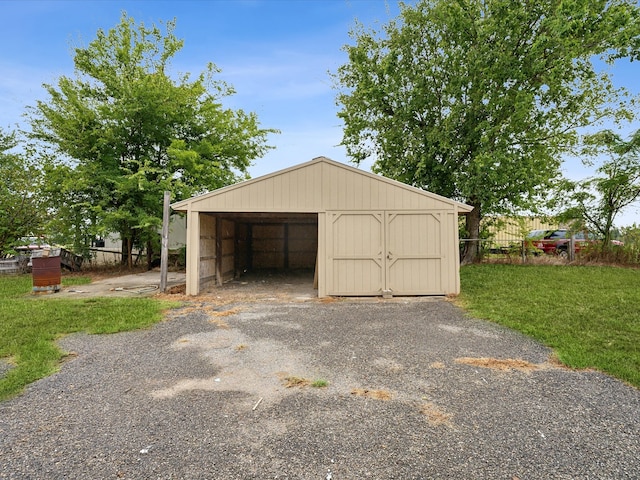 garage featuring a yard