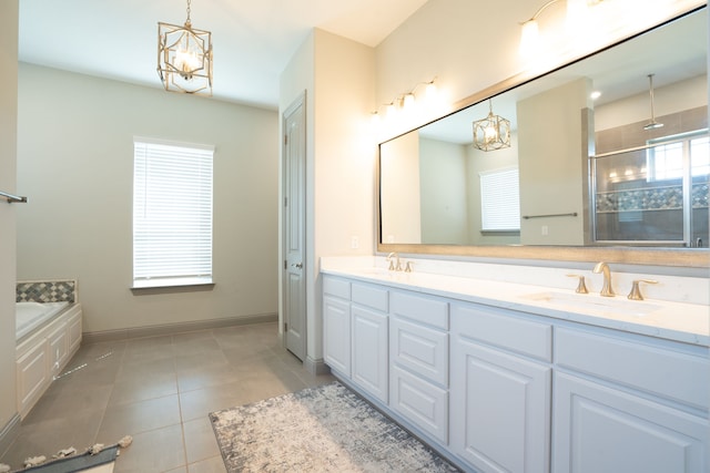 bathroom featuring vanity, an inviting chandelier, separate shower and tub, and tile patterned floors