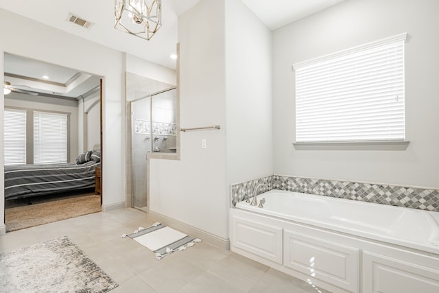 bathroom with ceiling fan with notable chandelier, separate shower and tub, and tile patterned flooring