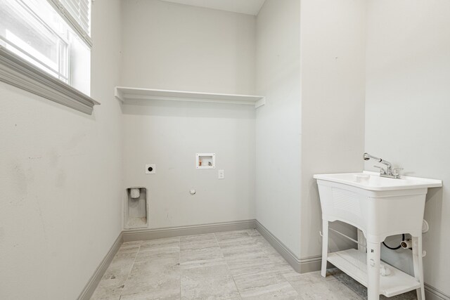 laundry area with hookup for a gas dryer, electric dryer hookup, and washer hookup