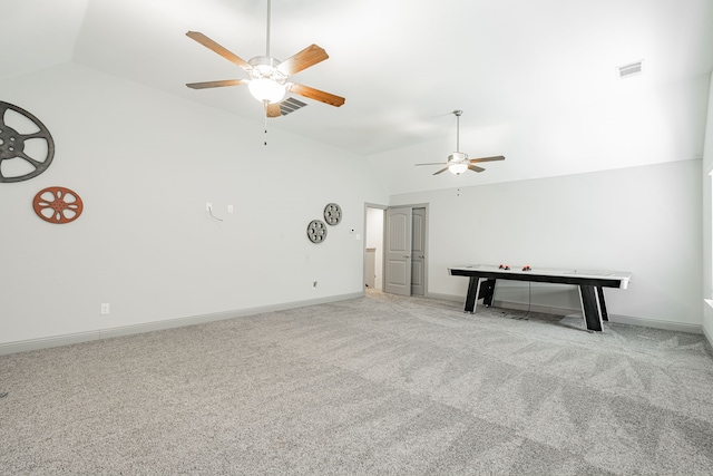 interior space with light carpet, lofted ceiling, and ceiling fan