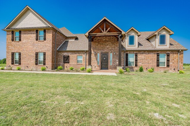 view of front of home with a front yard