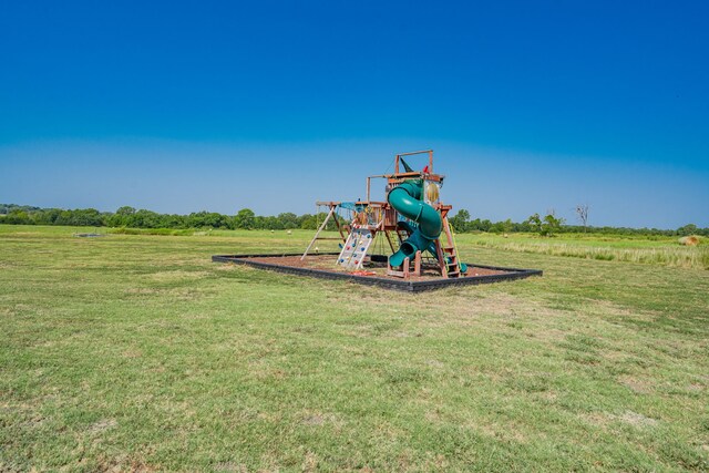 view of playground featuring a yard