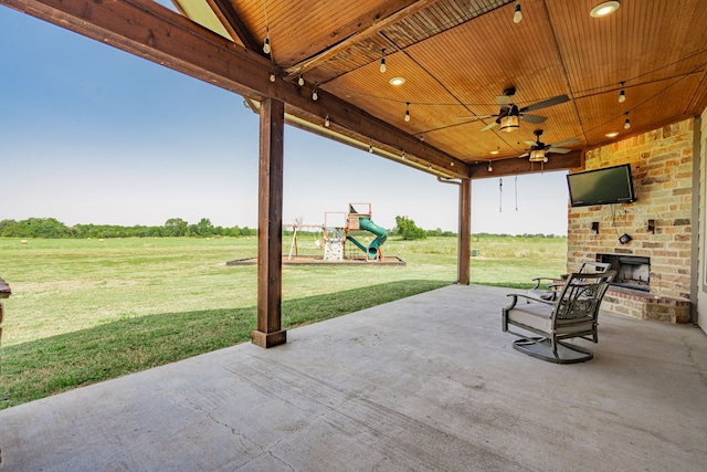 view of patio / terrace with a playground and ceiling fan