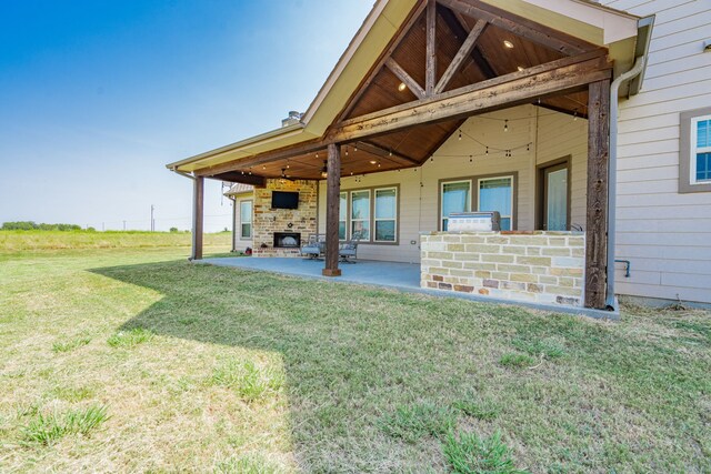 view of yard featuring ceiling fan and a patio area