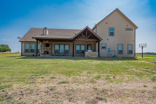 back of house with a yard