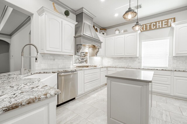 kitchen featuring appliances with stainless steel finishes, a center island, ornamental molding, custom exhaust hood, and white cabinets