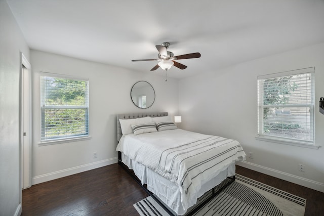 bedroom with ceiling fan and dark wood-type flooring