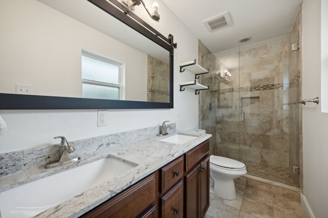 bathroom featuring vanity, an enclosed shower, and toilet