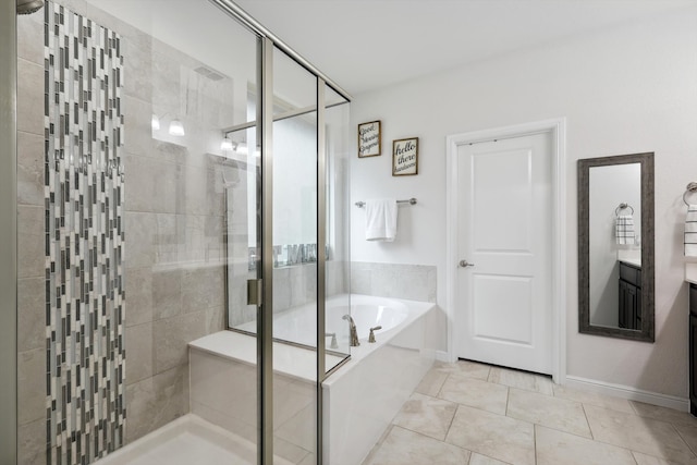 bathroom with tile patterned flooring, shower with separate bathtub, and vanity