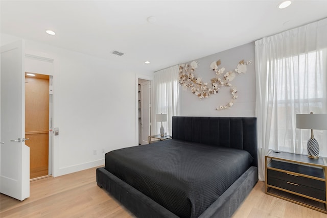 bedroom with light hardwood / wood-style flooring