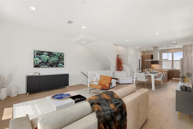 living room with light hardwood / wood-style floors