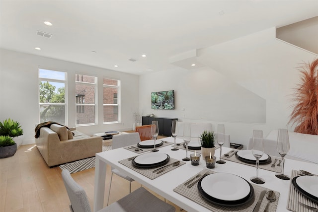 living room with light hardwood / wood-style floors