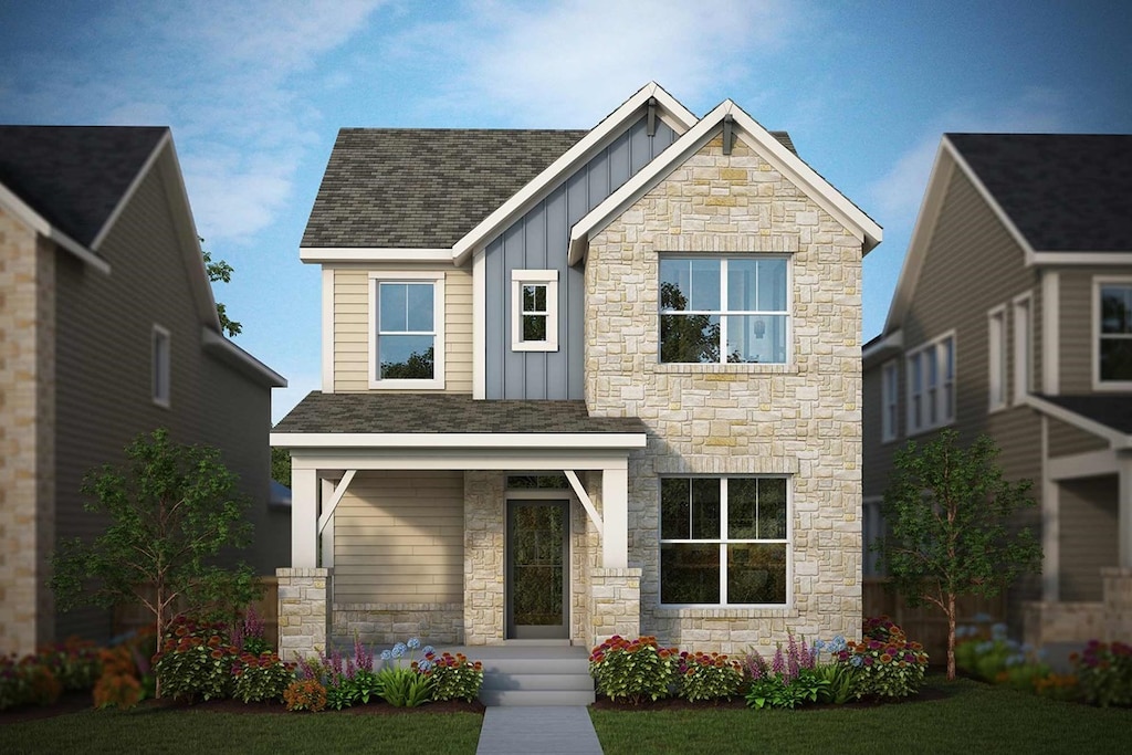 craftsman inspired home with covered porch and a front yard