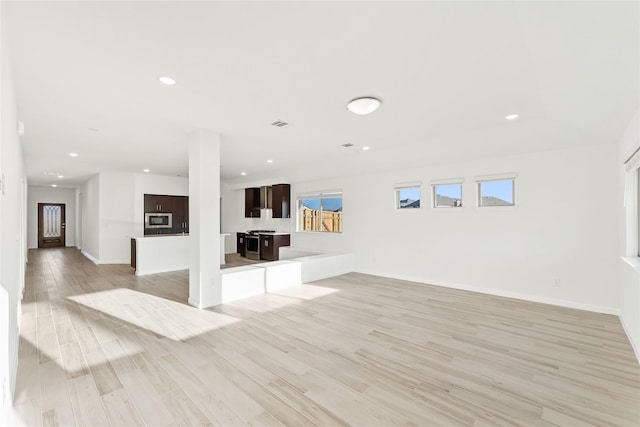 unfurnished living room featuring light hardwood / wood-style floors