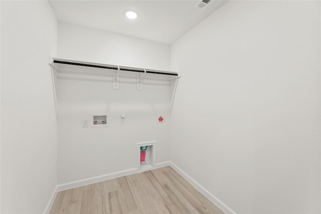 laundry area with gas dryer hookup, washer hookup, and light wood-type flooring