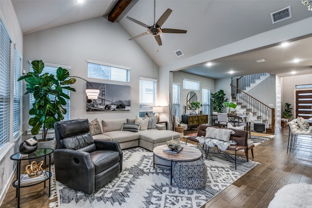 living room with ceiling fan, hardwood / wood-style floors, beamed ceiling, and high vaulted ceiling