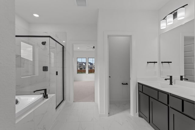 bathroom with vanity and independent shower and bath