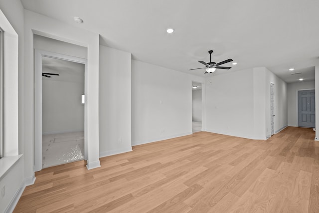 unfurnished living room featuring ceiling fan and light hardwood / wood-style flooring