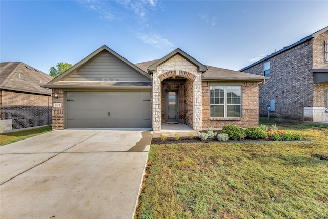 view of front of house with a garage and a front lawn