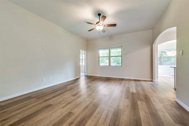 unfurnished living room with hardwood / wood-style floors and ceiling fan