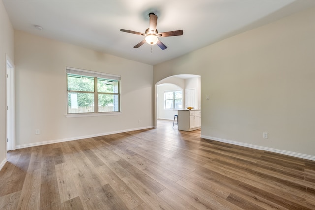 unfurnished room with ceiling fan and light hardwood / wood-style flooring