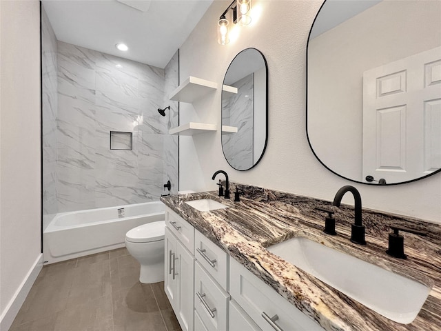 full bathroom with tiled shower / bath, vanity, and toilet