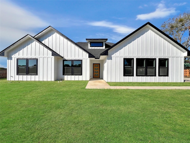 modern farmhouse with a front yard