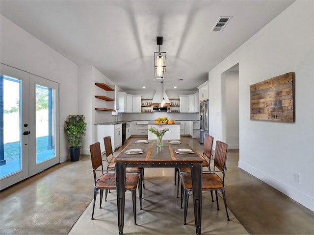 dining room with french doors and sink