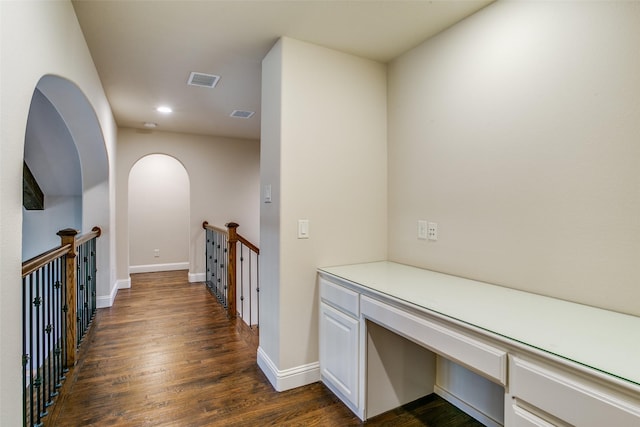 hallway featuring dark hardwood / wood-style flooring