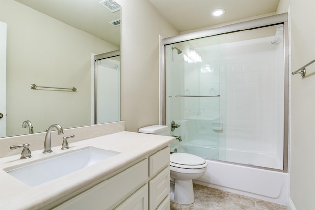 full bathroom with vanity, tile patterned flooring, combined bath / shower with glass door, and toilet